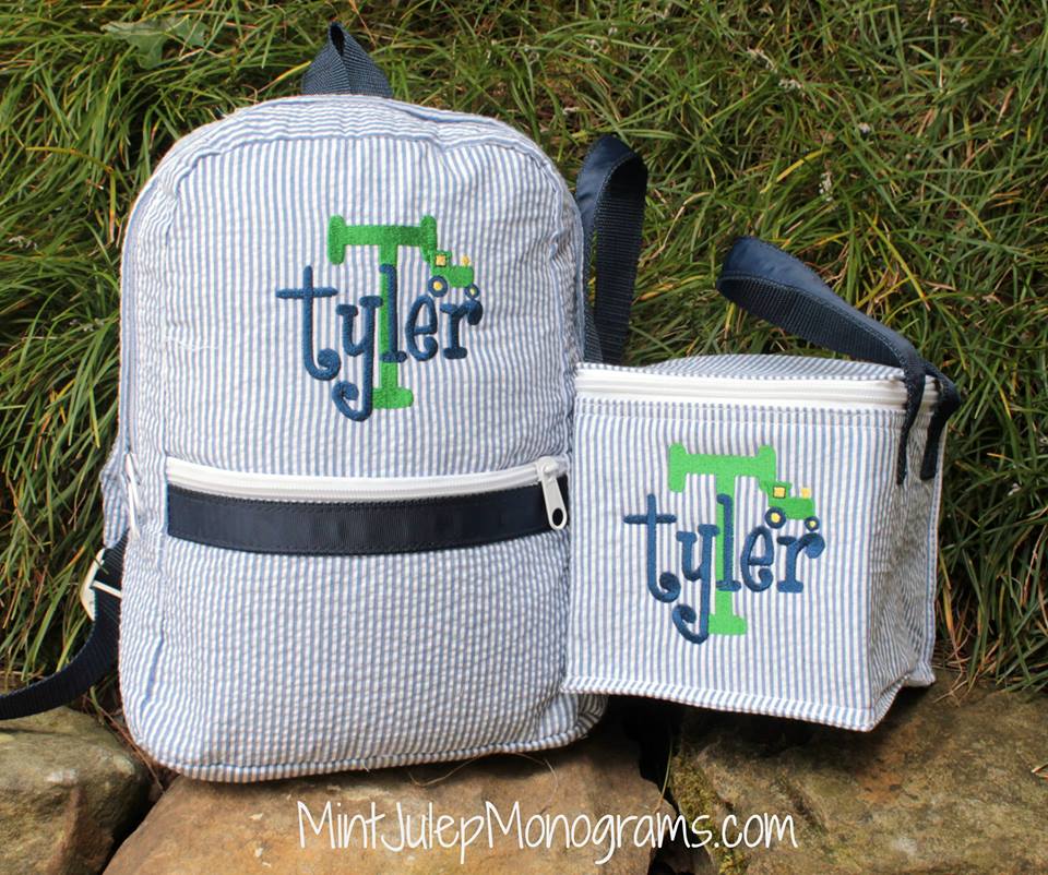 Navy Seersucker Small Backpack and Snack Square, Layered monogram with Kelly green and navy thread in Noah Font, Mini embroidery tractor design also shown here.