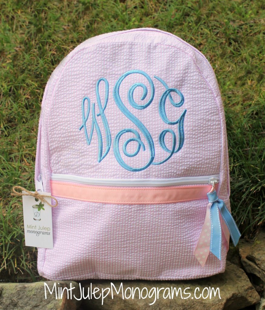 pink seersucker large backpack, baby blue thread, master circle font