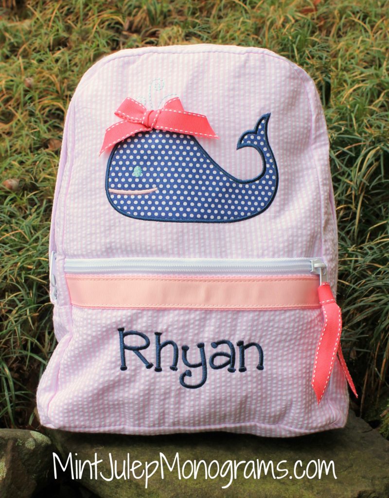 pink seersucker small backpack, whale applique design, navy thread, delightful font