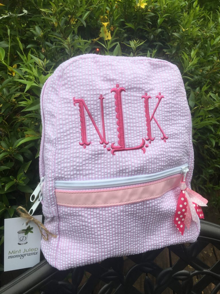 pink seersucker small backpack, hot pink thread, scallop fishtail font